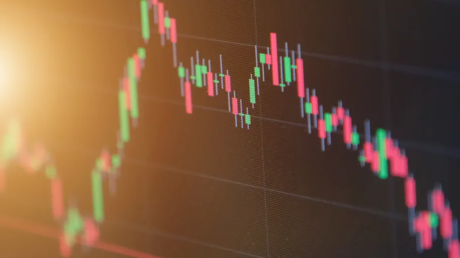 Closeup,Display,Of,Stock,Market,Quotes,With,City,Scene,Reflect